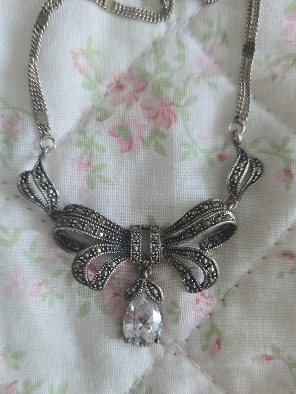 Silver Bow Pendant Necklace with Clear Teardrop Crystal